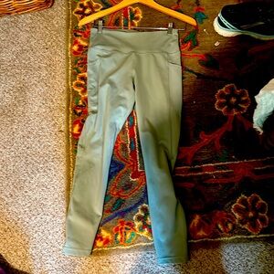 Womens running or workout tights with phone pocket in a sage green